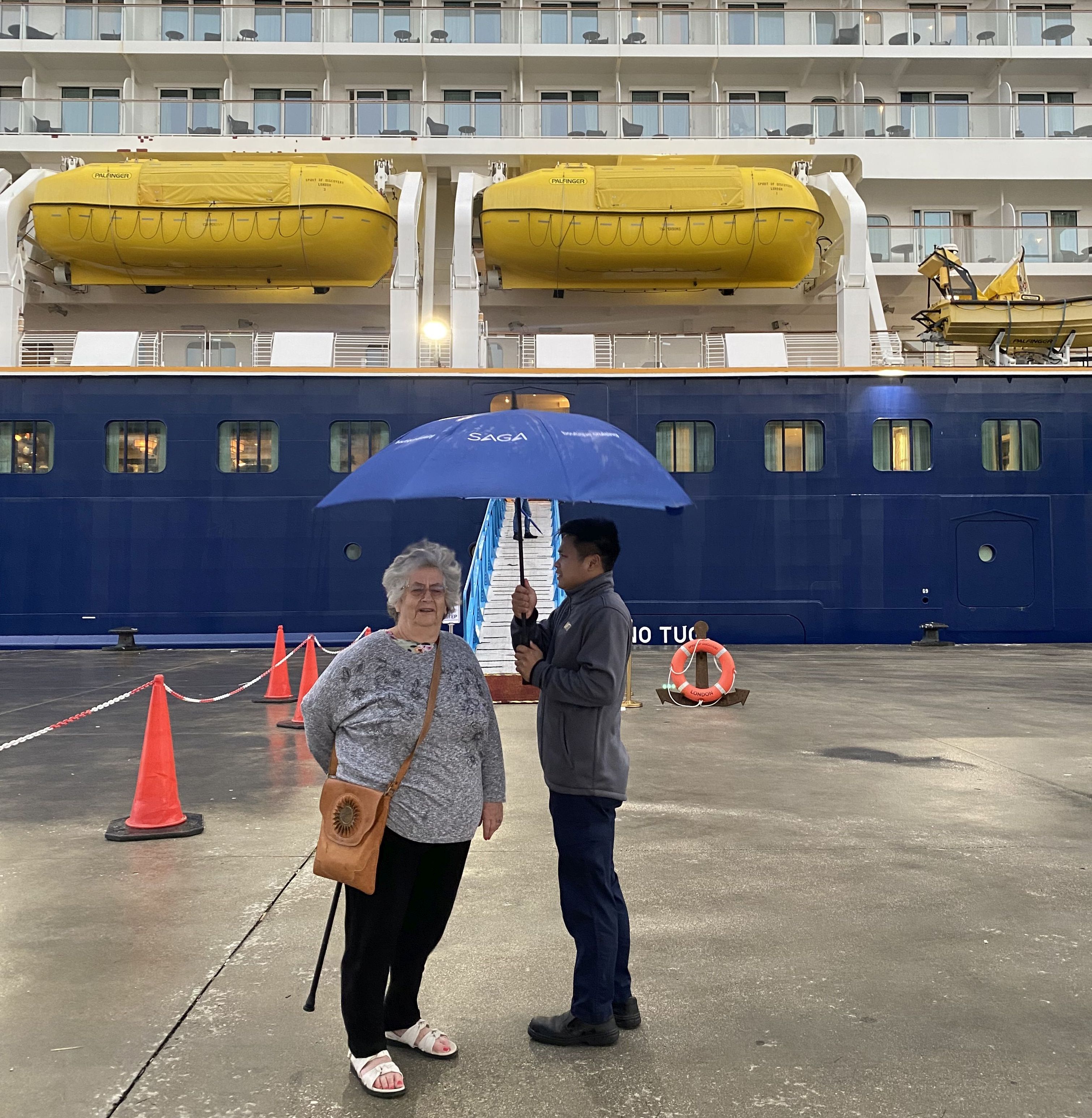 A crewman was very quickly down the gangway when the rain pelted.